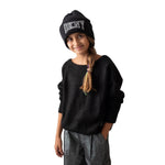 Jersey negro de punto DKNY para niña con banda elástica Konestilochic
