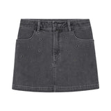 DKNY - D62354_Z11 – Minifalda vaquera con bolsillos y con detalle de ojales metálicos - Niña