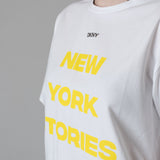 DKNY - D62579-535 – Camiseta blanca de manga corta con estampado amarillo - Niña